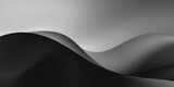 Abstract black and white nude form with soft curves and shadows