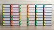 © Tonton1541 - financial compliance legislation organization concept. Stacked books with colorful tabs arranged neatly in rows.