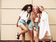 © halayalex - Three young beautiful smiling female in trendy summer clothes.Sexy carefree multiracial women posing on the street background.Positive models having fun in sunglasses. Cheerful and happy