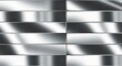 © Video4 - Metallic rectangles reflecting light with varying shades arranged in a grid pattern