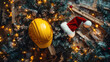 © syhin_stas - Construction worker's yellow hard hat paired with festive Santa hat adorning snow-covered Christmas tree at work site, blending holiday cheer with industrial safety spirit