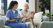 © peopleimages.com - Nurse, pills and tablet with old man on sofa for medical treatment, support or consulting. Medicine, digital schedule and caregiver with senior patient and woman in living room of home for advice