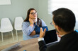 © AntonioDiaz - Injured woman discussing insurance claim with an agent