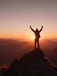 © Ilmi - Hiker Celebrates Achievement on Mountain Summit with Arms Raised Against Vibrant Sunset Background
