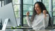 © Yuliia - Happy hispanic business woman win with computer in office ethnic businesswoman female girl manager typing pc winning excited online achieve success corporate victory glad rejoice good news celebrating