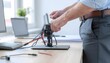 © Mirana - Technician Adjusting Electronic Device with Wires on Desk.