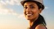 © Space Priest - Female engineer smiling in hard hat at construction site during golden hour