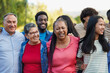 © Sabrina - Crowd of multi generational people hugging each other in front of camera at city park - Multiracial friends, community and social inclusion concept
