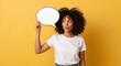 © Viktor - Thoughtful young african female with speech bubble on yellow background