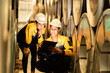 © Montri - Two industrial engineers reviewing inventory data with clipboard inside metal roll storage warehouse. Concept of stock checking, teamwork, factory logistics, and material control. engineer, two worker