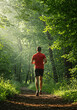 © KM - Running Through Nature's Embrace: A solitary figure, clad in vibrant attire, embarks on a refreshing run through a sun-dappled forest trail.