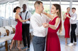© JackF - Energy man and young woman are dancing classic version of waltz in couple during lesson at studio. Leisure activities and physical activity for positive people.