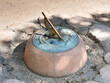 © Rix Pix - Stone and metal garden sundial on a garden path