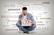 © New Africa - Troubled man with laptop trying to remember password and username. Light background with words
