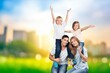 © BillionPhotos.com - Happy young family with children at nature park background