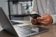 © onephoto - man checking new email notification on phone in workplace Communication networking or social media. Agenda, app and schedule with man checking calendar