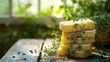 © Scream - Stack of Homemade Thyme Soap on Rustic Wooden Table