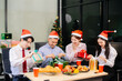 © laddawan - Christmas party! Festive decor, Santa hats, gifts, food, and cheerful coworkers bring joy and togetherness this holiday season