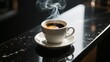 © MiMoShi - Hot espresso in white cup with rising steam placed on glossy black marble counter under soft sunlight