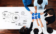 © InfiniteFlow - A diverse team of professionals collaborates around a white table, fitting puzzle pieces together while discussing artificial intelligence and innovative strategies. Trope