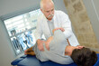 © auremar - senior physio taking care of young patient