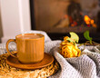 © SEPT-DESIGN - Cozy Photorealistic Scene: Mug of Hot Cider on a Blanket with Fireplace Bokeh Background