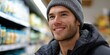 © Iryna - Smiling caucasian young male shopping in grocery store aisle
