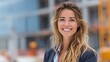 © Jayk - Smiling woman with long blonde hair in front of a construction site