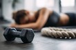 © Mykola - Too Much Exercise. Woman Exhausted after Home Workout with Dumbbells on Exercise Mat