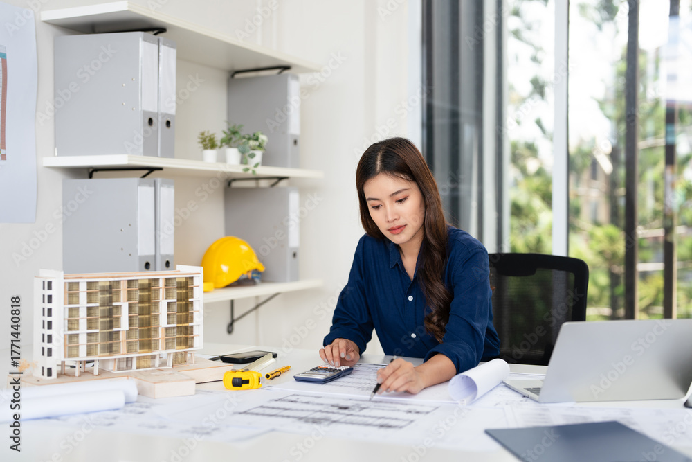 Civil Engineer working on shop drawings of post tension slab plan on ...