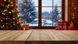 © NK_Media - Wooden table foreground with blurry christmas tree and festive gifts inside a rustic house, looking out a window at a snowy winter forest scene at holiday time copy space