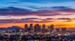© rahma - Panoramic view of Phoenix city skyline against a vibrant sunset sky filled with dynamic clouds