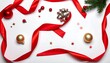 © cbnyeni - Festive overhead shot. Red ribbon swirls, Christmas baubles, tiny stars, shiny silver bow, and evergreen accents adorn a white backdrop