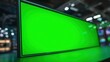 © Peindre - イベント会場の暗い空間に設置された、コンテンツ合成用のグリーンバックが表示された大型デジタルディスプレイ | Large digital display showing a green screen for content overlay, set in a dark space at an exhibition or event venue.