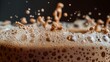 © tynza - Macro capture of roasted coffee foam rising in a cezve