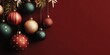 © YOUR - Group of assorted holiday ornaments hangs against a deep red background with sparse decorative elements