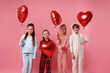 © New Africa - Cute children in pajamas with heart shaped balloons on pink background
