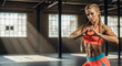 © Milan - Athletic woman with muscular abs making a heart shape with her hands in a gym. Strong female athlete showing self-love after a workout. Fitness motivation concept with copy space
