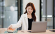 © David - Beauty young asia smiley woman  working at the office, using laptop on desk.
