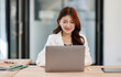 © David - Beauty young asia smiley woman  working at the office, using laptop on desk.