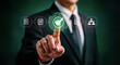 © Muin - Businessman touching a digital interface with a green checkmark, representing approval, confirmation, and successful task completion in a modern business setting