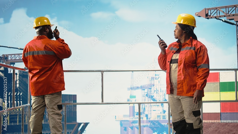 Drilling barge engineers use two way radio to communicate with ...