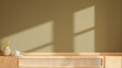 © Vanitjan - Minimal interior scene with a light wooden table, a ceramic coffee cup, and a simple vase with dry plants under warm sunlight casting shadows on the wall- 3D rendering