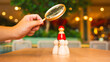 © sommart - Magnifying glass inspecting wooden toy figures symbolizing leadership, recruitment, and talent search. Concept for HR, business management, and team building strategy.