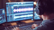 © Mikhail Vorobev - Man wearing headphones working on audio editing software with multiple sound waveforms displayed on several computer screens in dimly lit studio environment