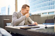 © ADDICTIVE STOCK - Man taking a coffee break in sunny outdoor office setting