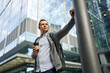 © ADDICTIVE STOCK - Man enjoying a break outside modern office building