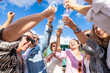 © Martí Rosselló - Friends cheering with wine glasses enjoying outdoor party
