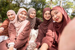 © ADDICTIVE STOCK - Young Muslim women enjoying time with friends