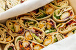 © 9parusnikov - Chicken wrap rolls with fresh vegetables in paper box